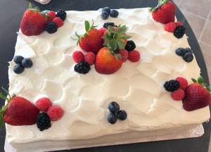 Photo of a white cassata cake with strawberries
